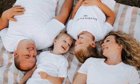 a group of people laying on top of each other